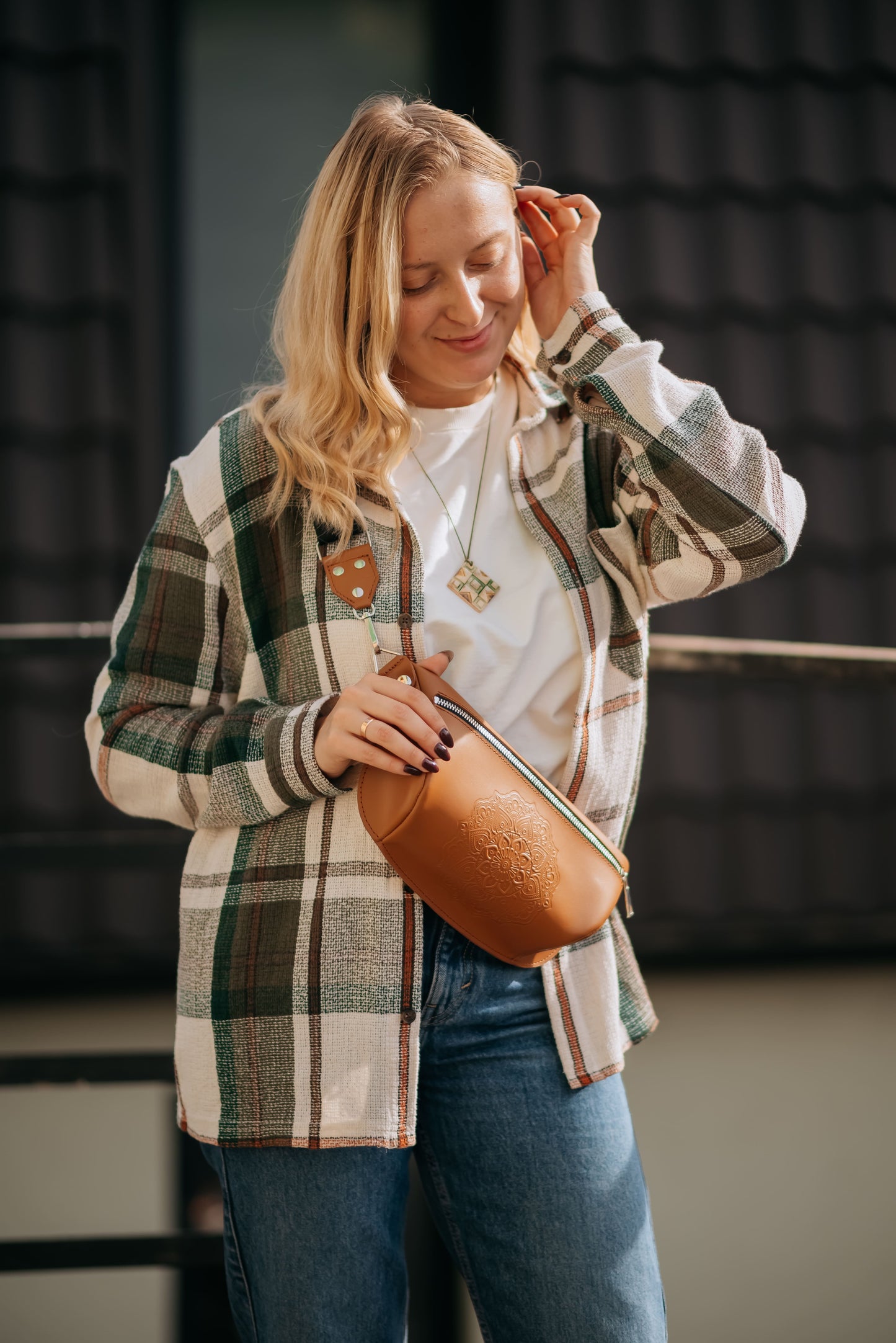 Leather banana bag with floral embossing