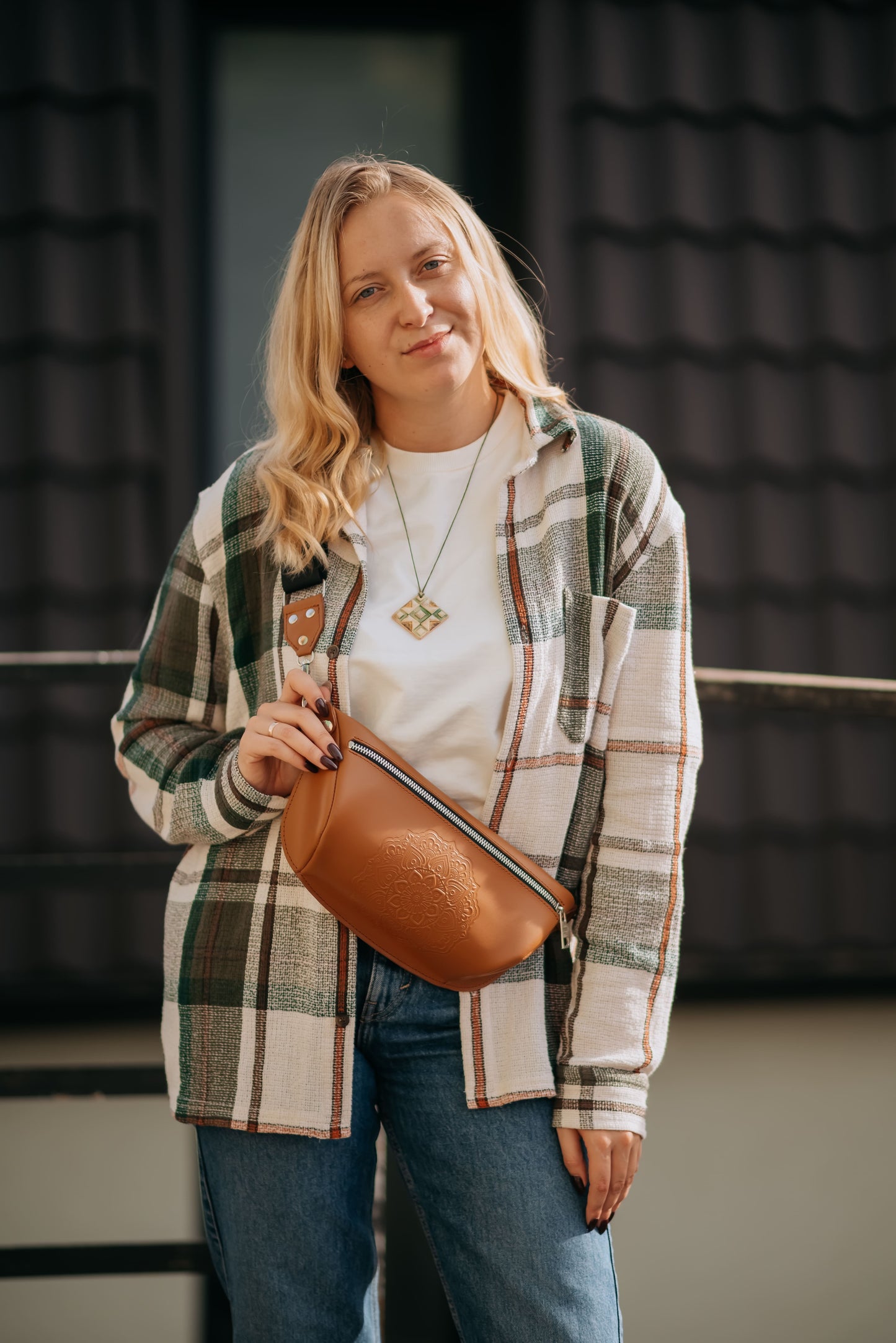 Leather banana bag with floral embossing