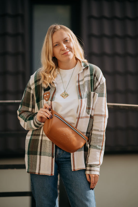 Leather banana bag with floral embossing