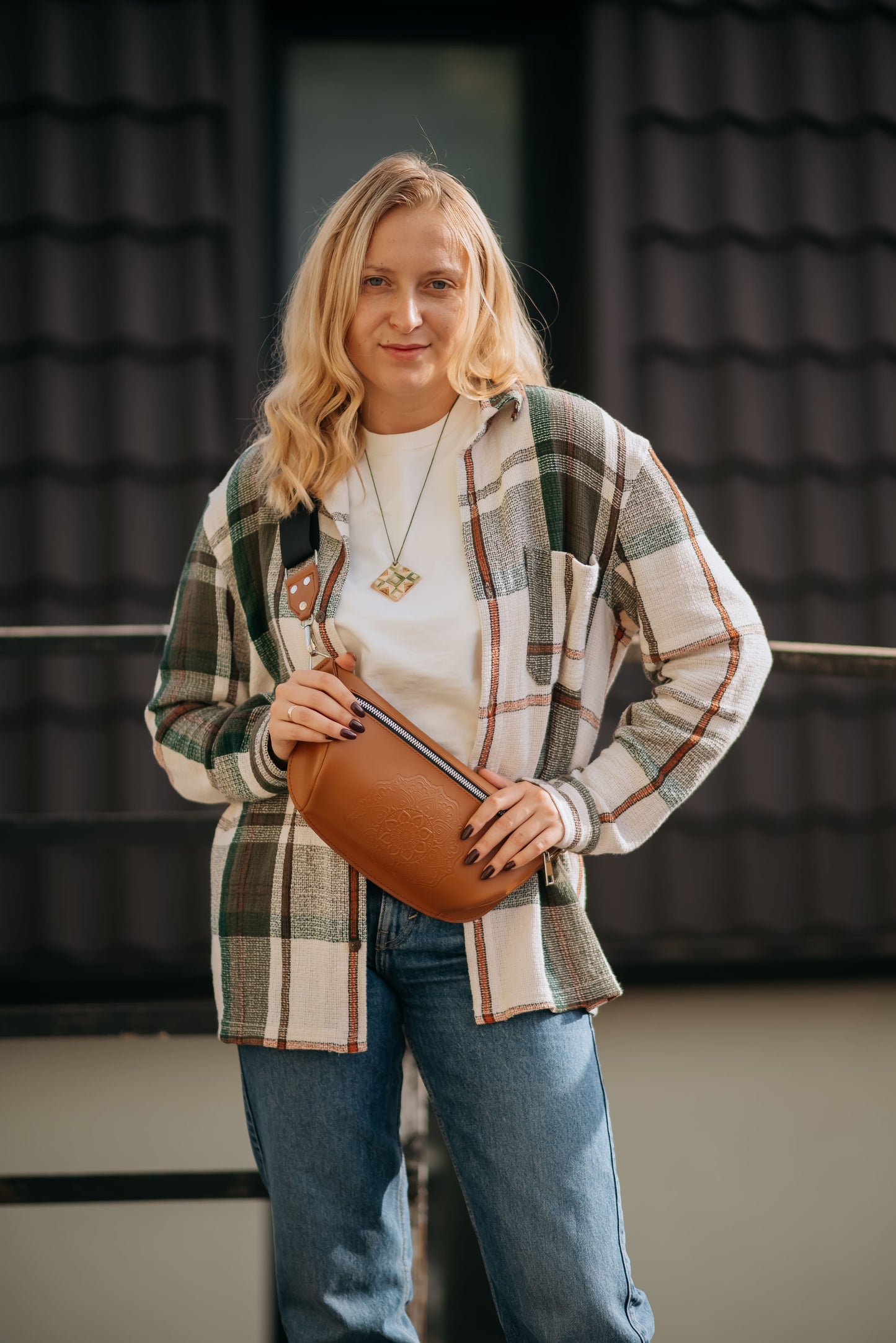 Leather banana bag with floral embossing
