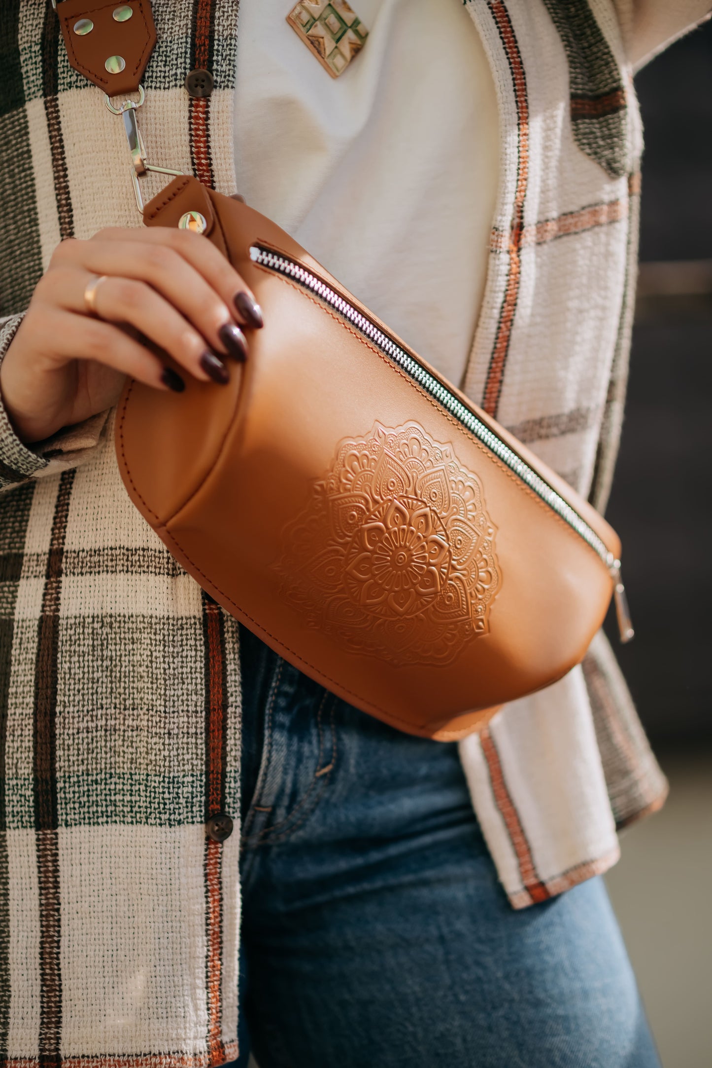 Leather banana bag with floral embossing