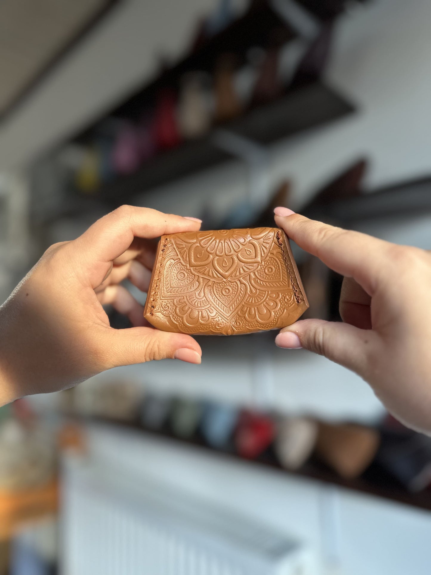Leather coin box with floral embossing